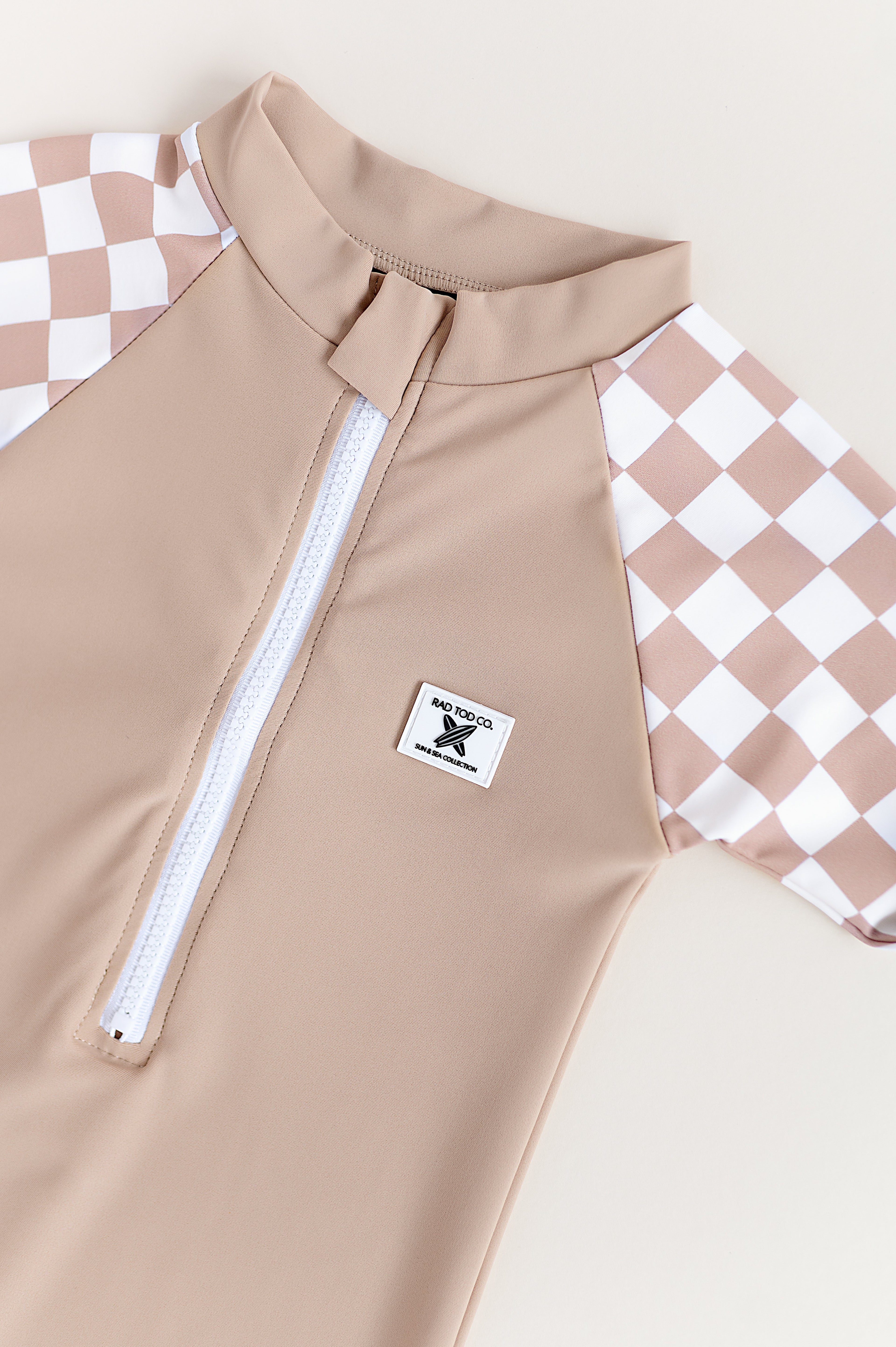 UPF 50 RASHGUARD ONESIE - DUNE CHECKERS