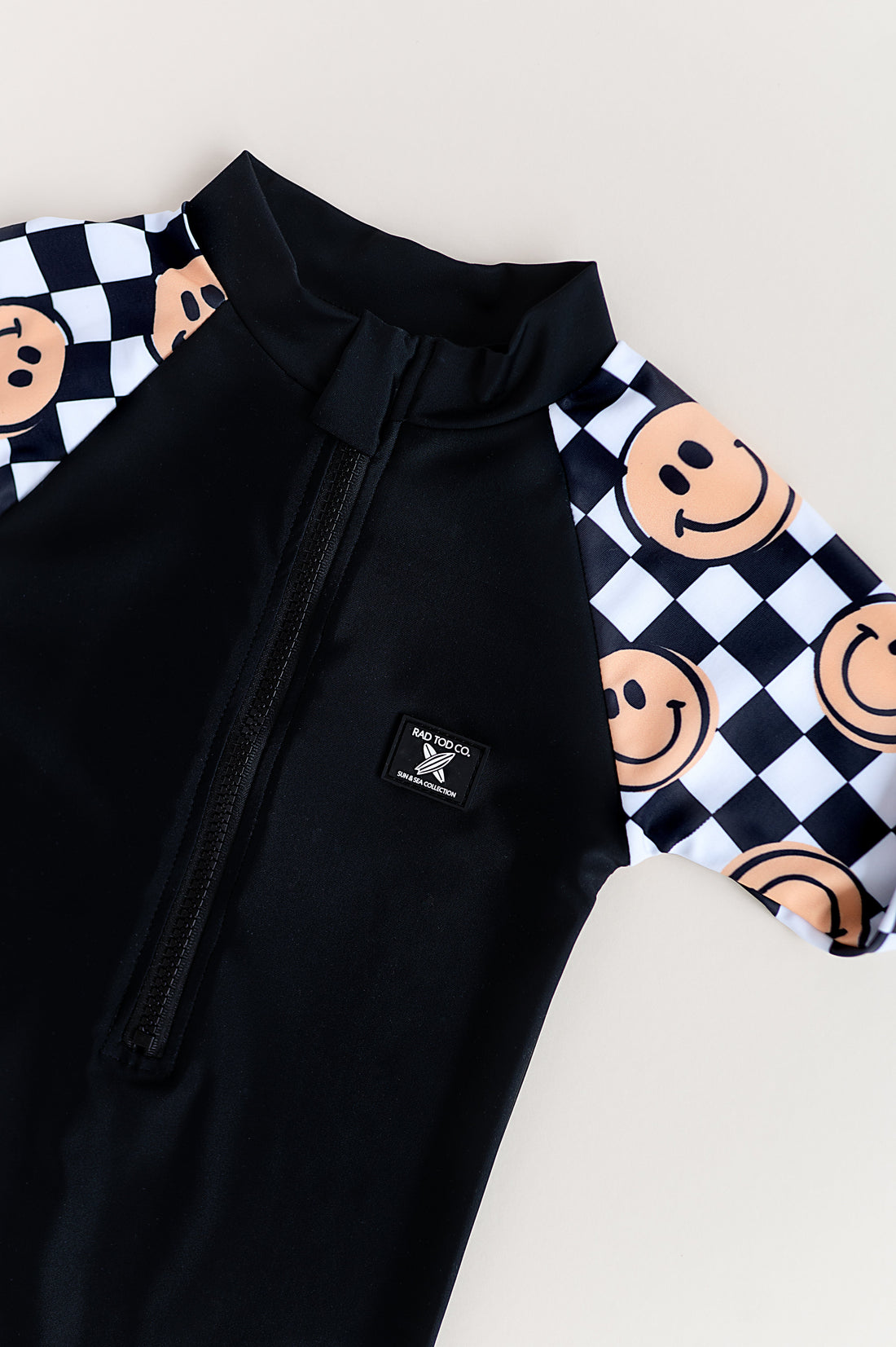 UPF 50 RASHGUARD ONESIE - HAPPY SURF